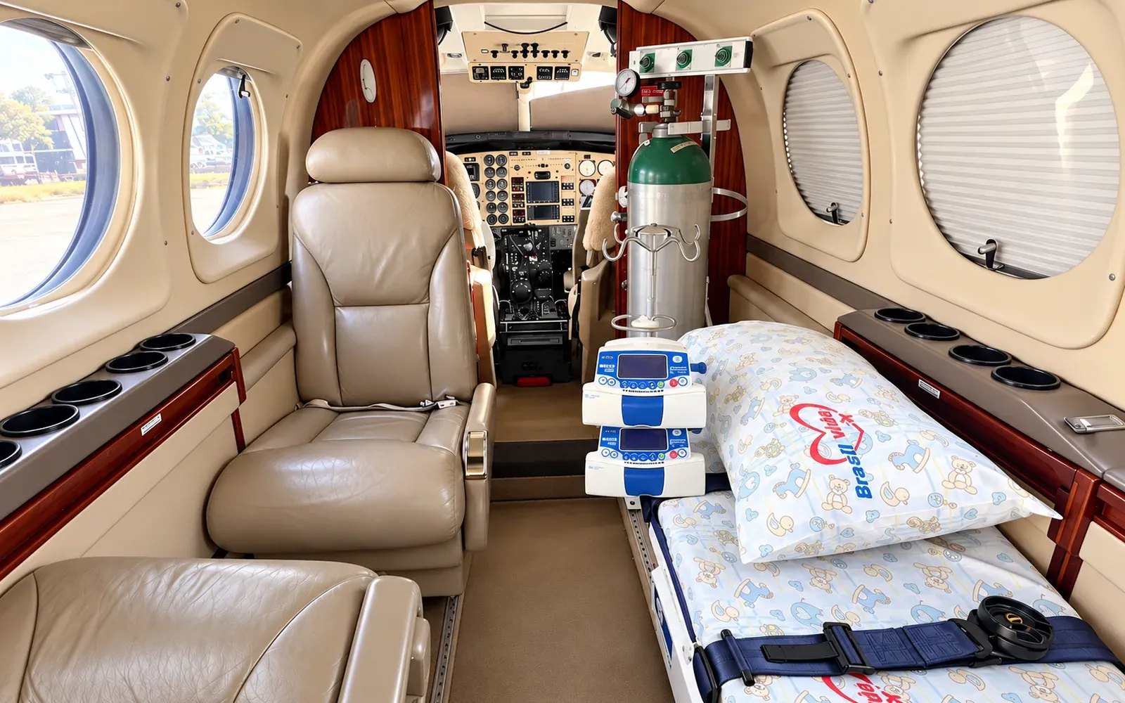 King Air C90GT cabin in aeromedical configuration with stretcher, patient monitor and infusion pumps