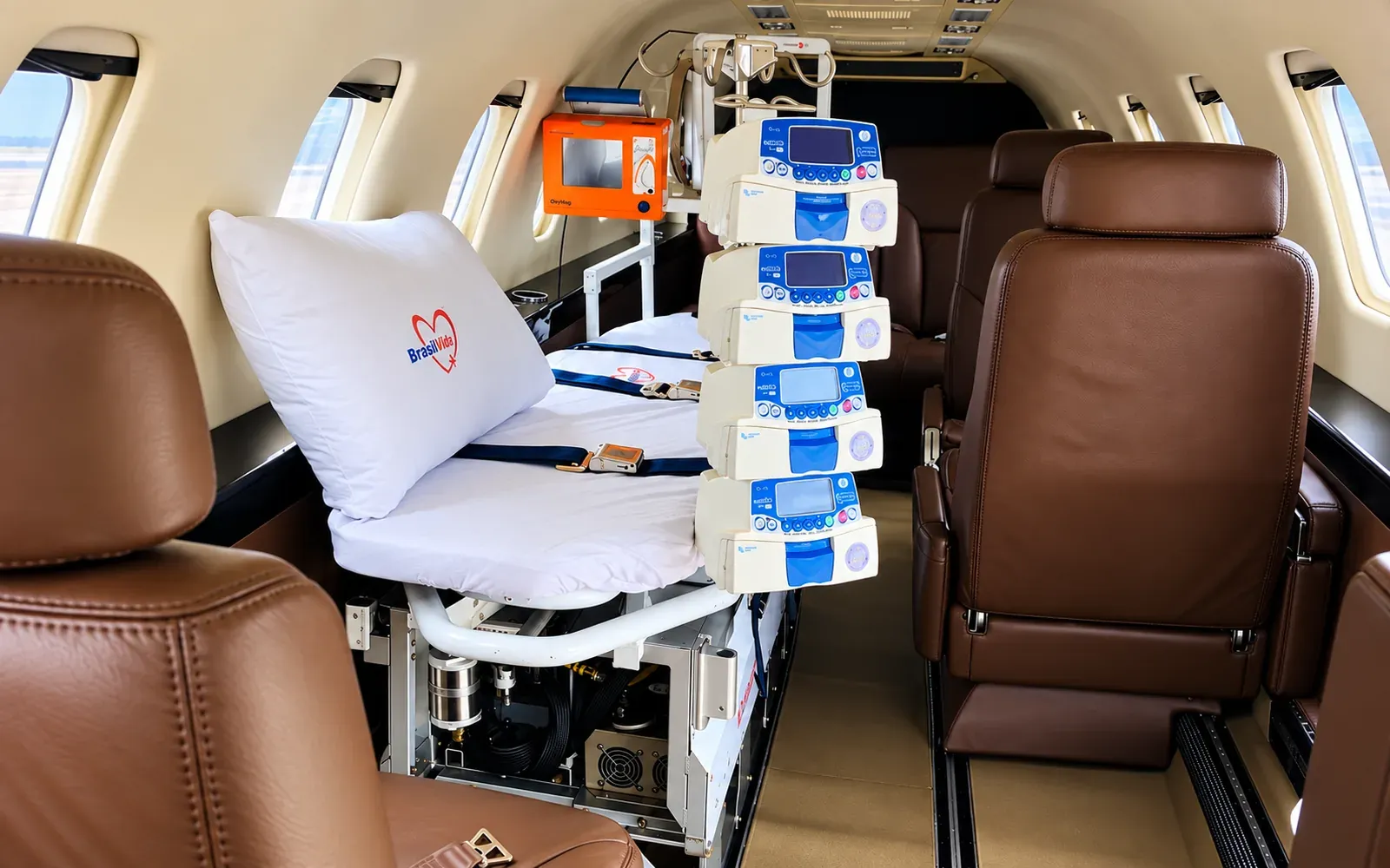Learjet 35A cabin in aeromedical configuration with stretcher, patient monitor and infusion pumps