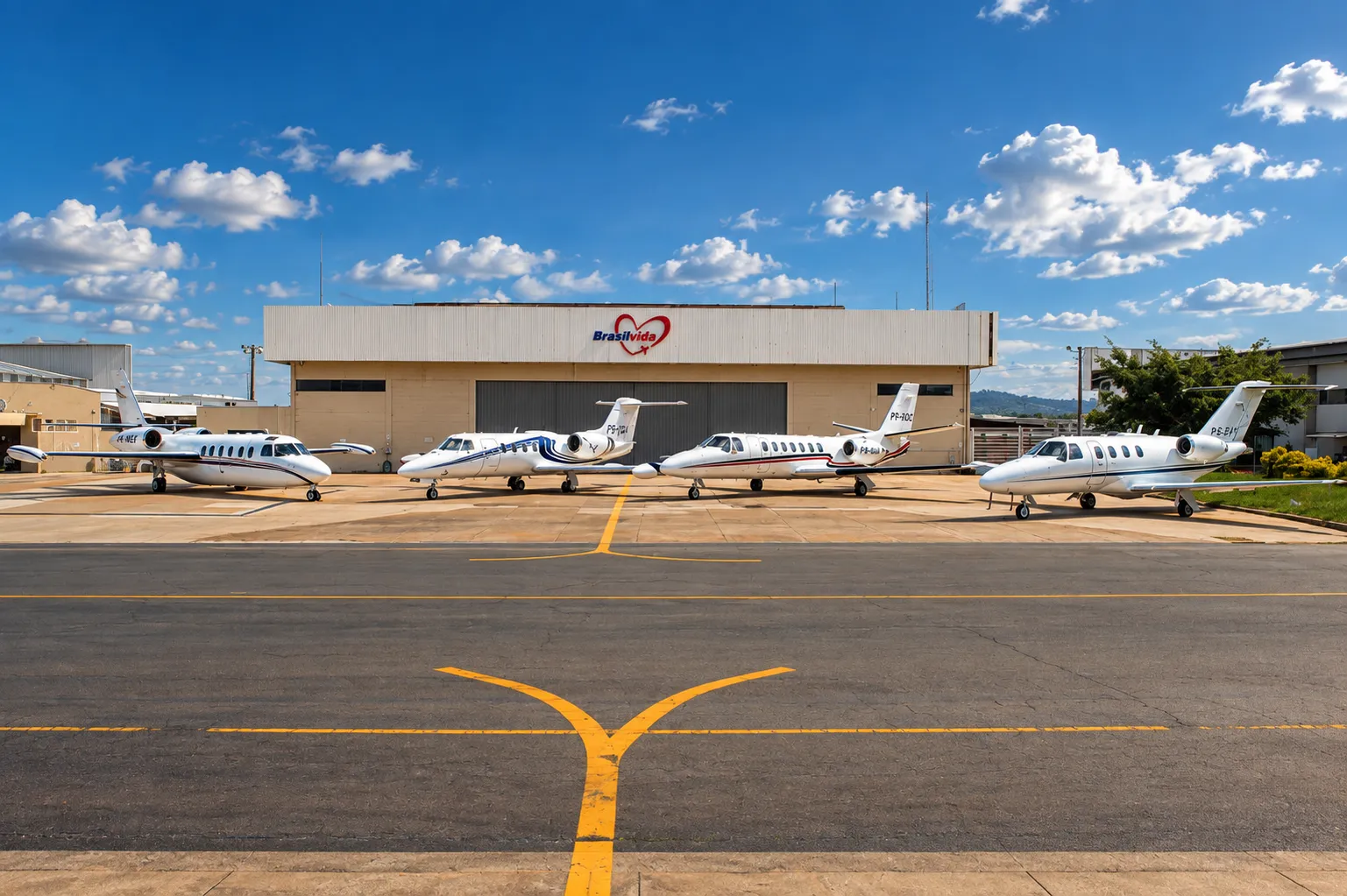 Brasil Vida jet fleet parked on the apron in front of the company hangar