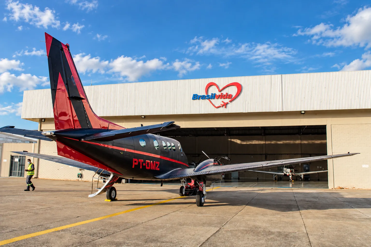 Brasil Vida turboprop aircraft parked on the ramp in front of the company hangar